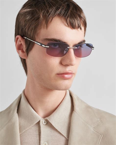 prada sunglasses with iconic metal plaque